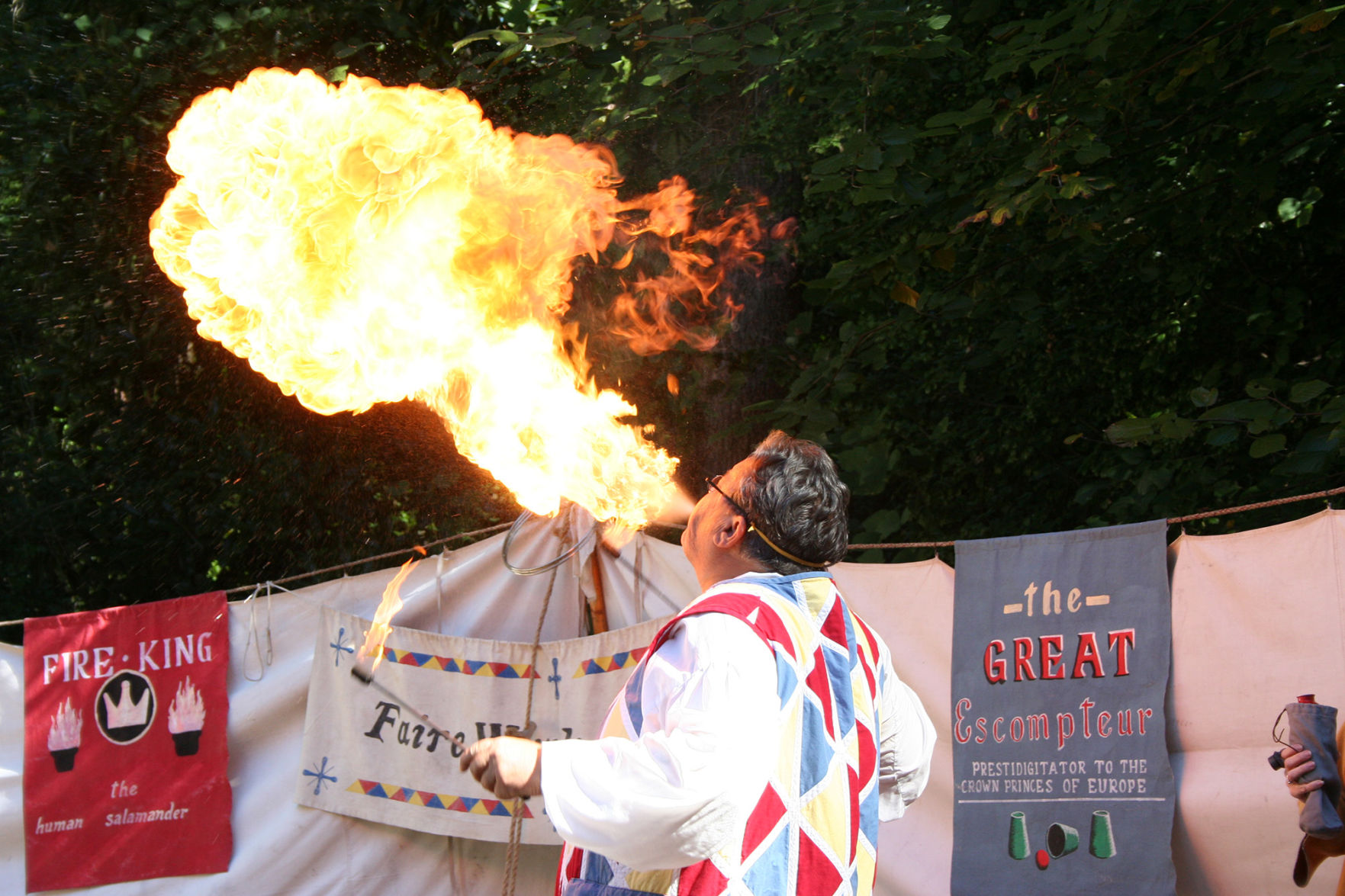 The Great Escompteur (his name is really Eric Scites) imitates a fire-breathing dragon at the Faire Wynds Circus at Colonial Times Living History Park in North Augusta.